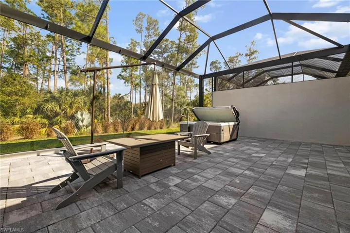 View of patio / terrace featuring glass enclosure