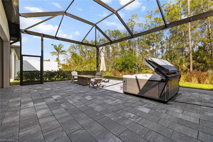 View of patio with a lanai