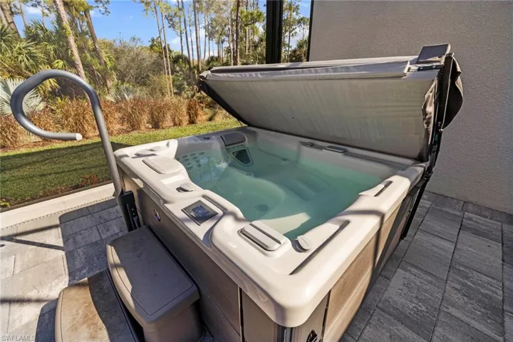 View of patio featuring a hot tub