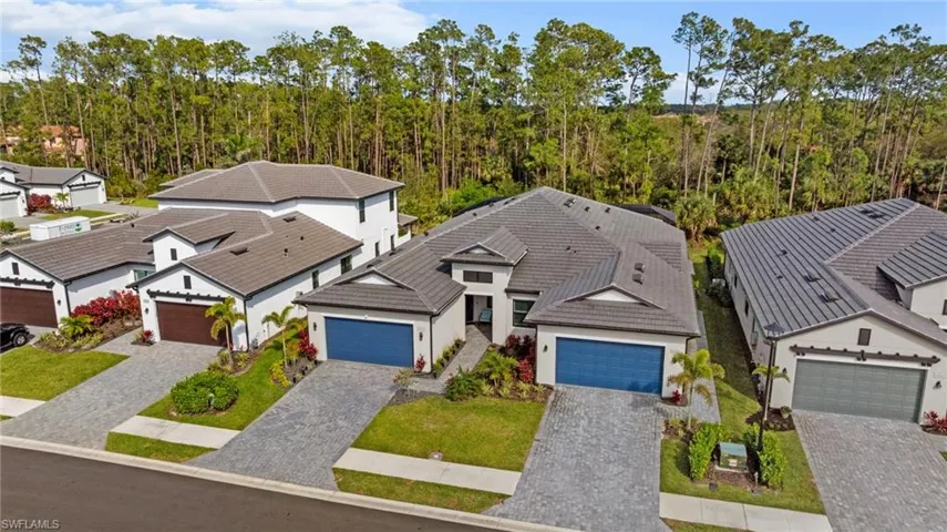 Drone / aerial view with a residential view and a view of trees