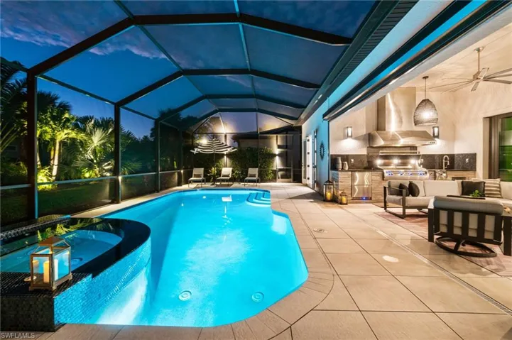 The lanai is accented with elegant perimeter lighting, while the front and rear yards are beautifully illuminated with extensive landscape lighting, creating a stunning atmosphere