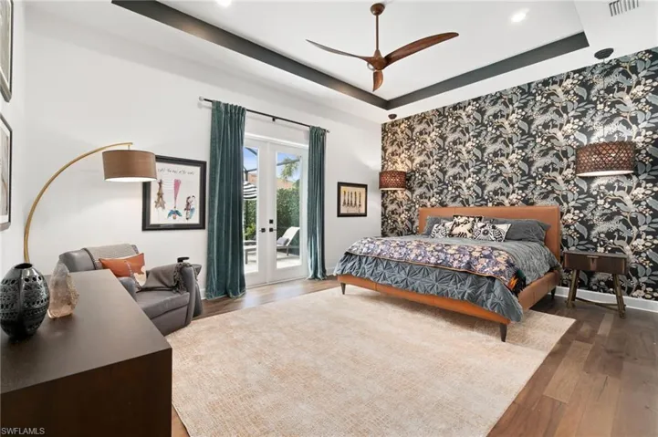 A custom-designed master suite featuring upgraded wood flooring