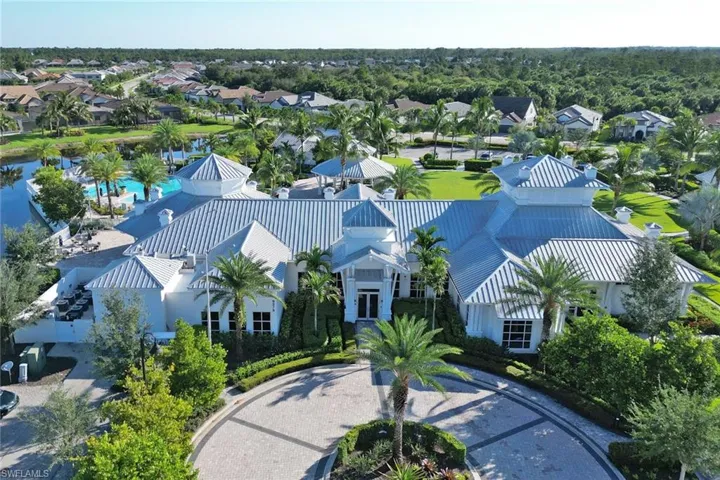 An 8,000-square-foot amenity center featuring a clubhouse with a community room, catering kitchen, outdoor pavilion, restaurant, and card room