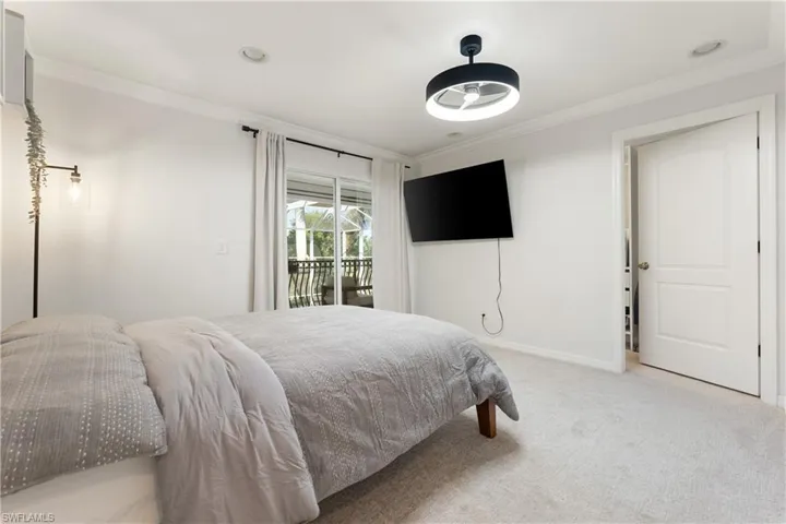 Bedroom with crown molding, carpet flooring, access to exterior, and recessed lighting