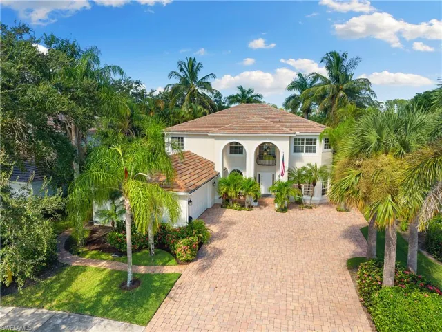 Mediterranean / spanish-style home with decorative driveway, stucco siding, a garage, and a front yard