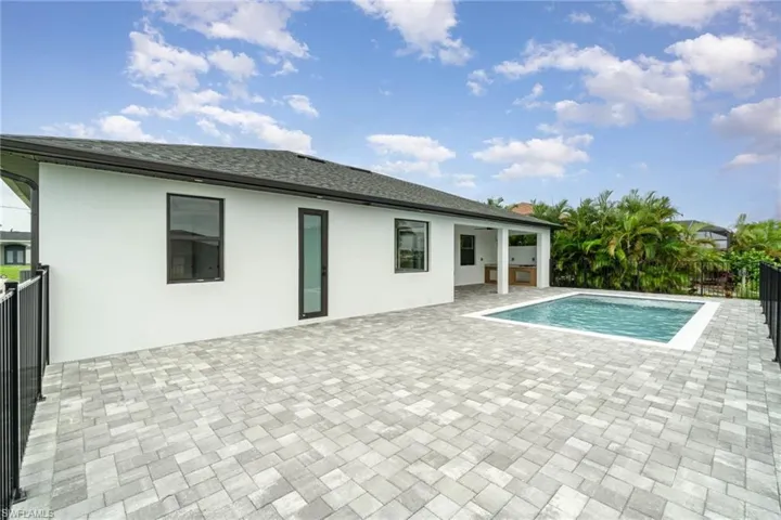 View of pool with a patio- screen cage to be added