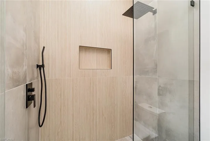 Bathroom with a tile shower