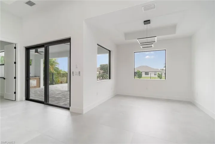 Empty room featuring light tile patterned flooring