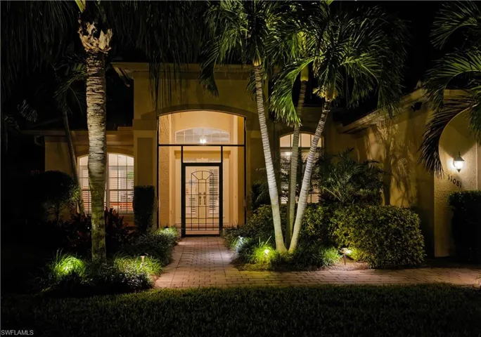 View of exterior entry at night