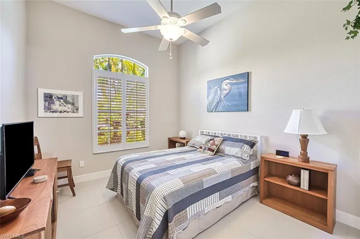 Tiled bedroom with ceiling fan