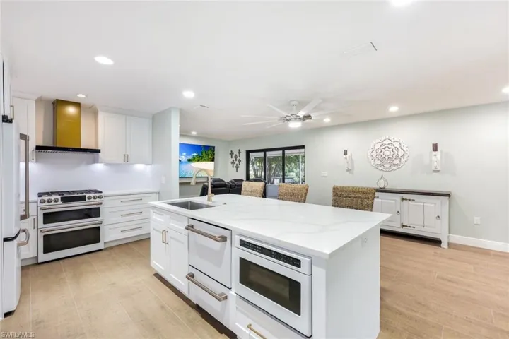 Kitchen features GE Café appliances, quartz countertops, and plenty of storage space.