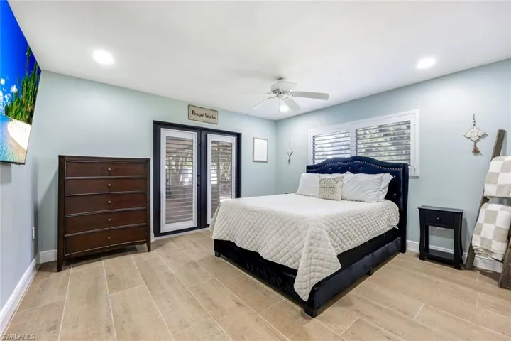 Guest bedroom offers lanai access.