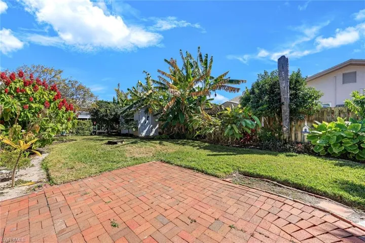 Several fruit trees surround this property include an ice cream banana tree, a strawberry guava tree, and a dragon fruit tree.