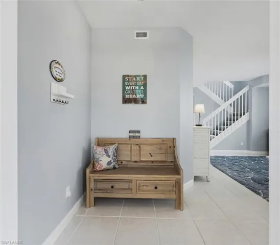 Sitting room featuring baseboards and light tile patterned floors