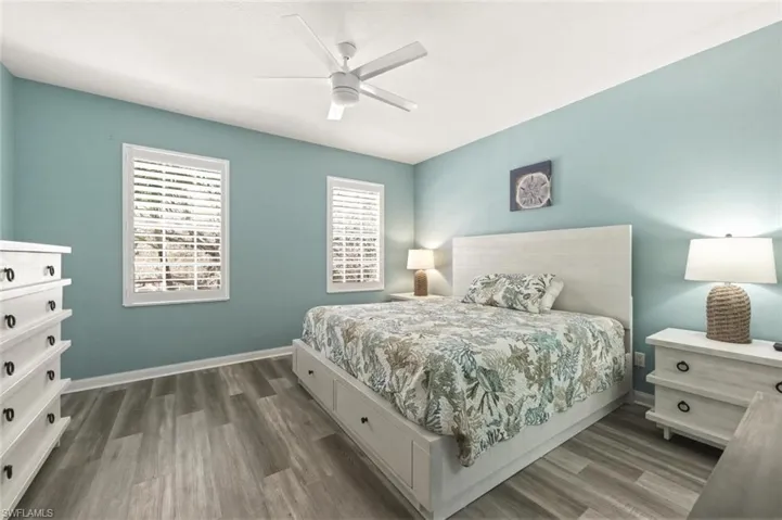 Bedroom featuring wood finished floors and a ceiling fan