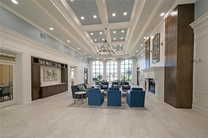 Building lobby featuring a decorative wall, recessed lighting, and crown molding
