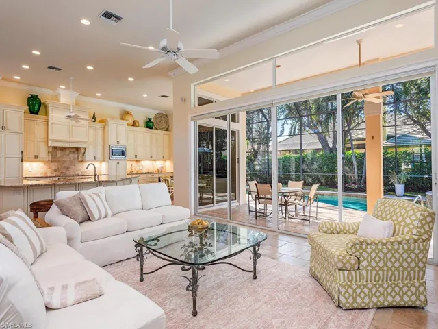 Open concept Living Room, Gourmet Kitchen and Pool Views.