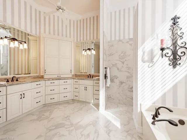 Master Bath with walk in shower, separate tub and dual vanity sinks.
