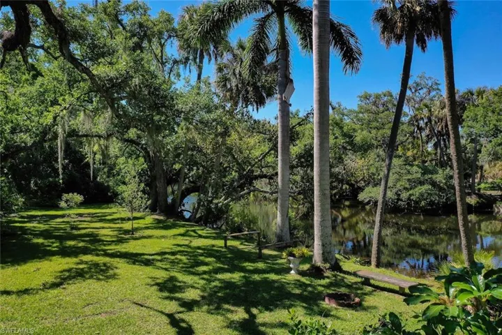 View of yard with a water view