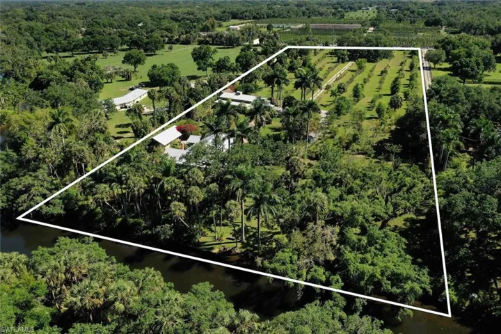 Drone / aerial view with a water view and a rural view
