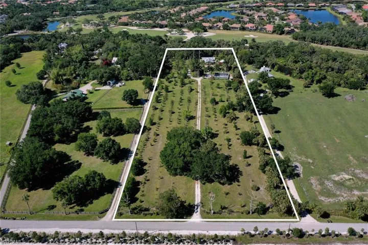 Aerial view featuring a water view and a rural view