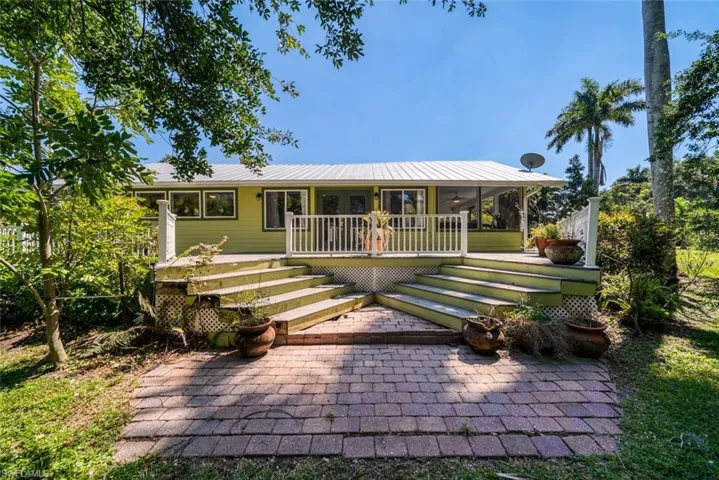 View of front of property with a patio and a porch