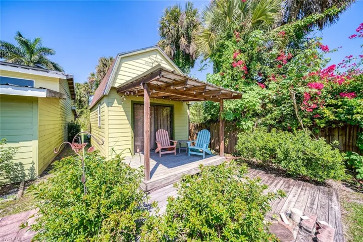 Rear view of property featuring a wooden deck