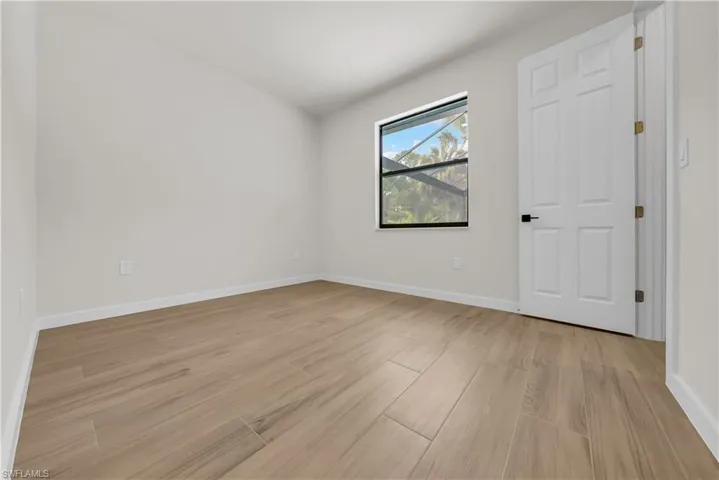 Empty room featuring light wood-style flooring
