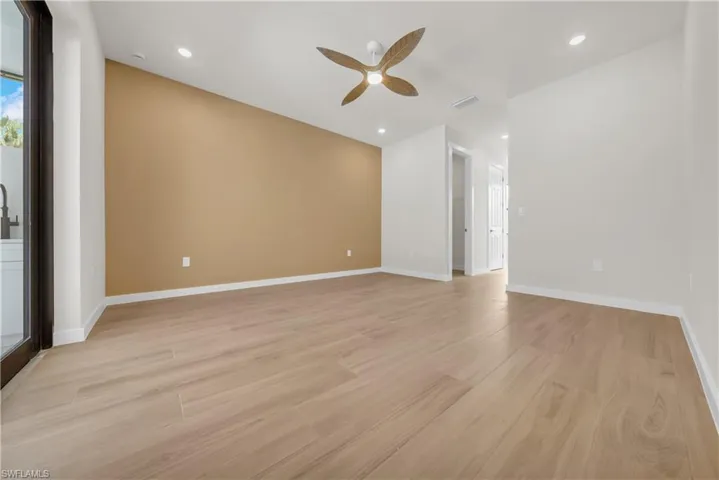 Spare room with light wood-type flooring, recessed lighting, and ceiling fan