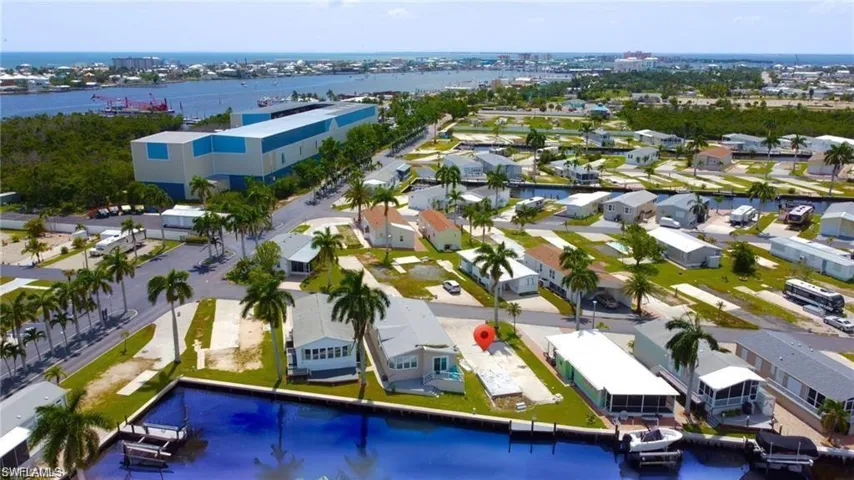 Aerial view - of property and surrounding bodies of water- virtually enhanced