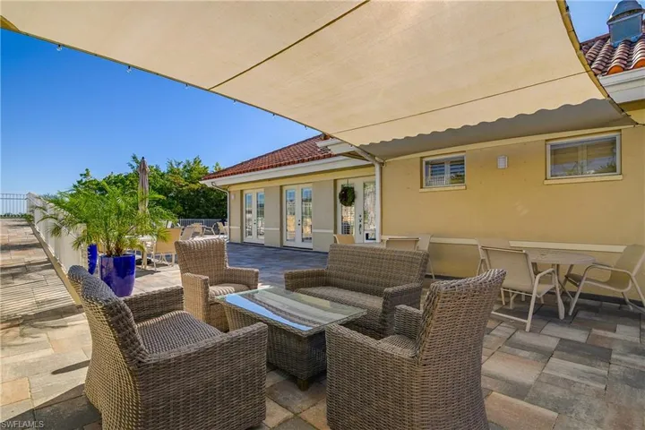 View of patio / terrace with outdoor dining space, french doors, and outdoor lounge area