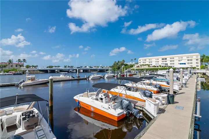 Dock featuring a water view and view of marina