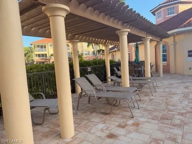 Community patio area featuring a pergola — perfect for outdoor gatherings and Florida entertaining