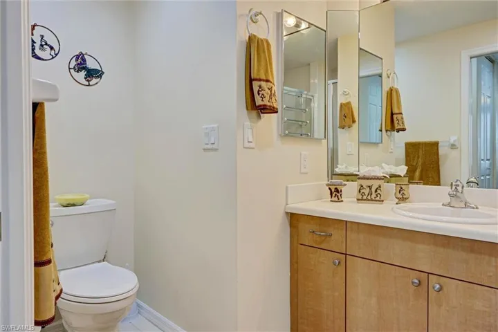 Guest bathroom with vanity and toilet — clean and functional