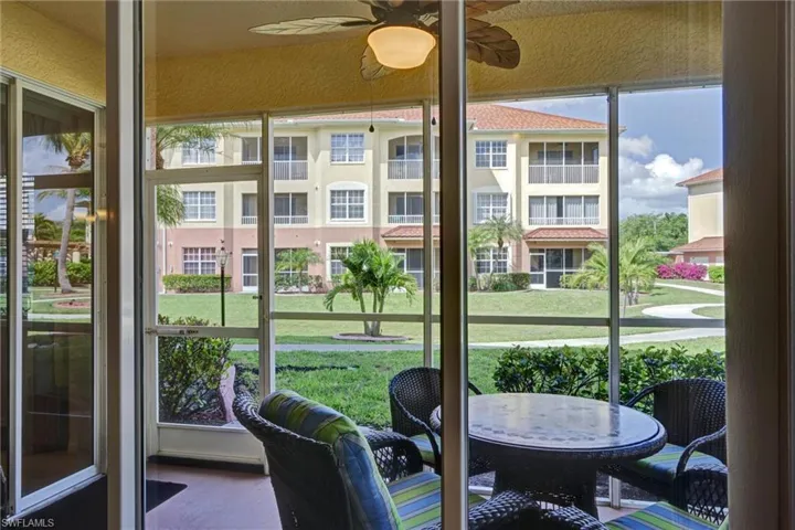 Screened lanai with ceiling fan and dedicated outdoor dining area — ideal for Cape Coral waterfront lifestyle
