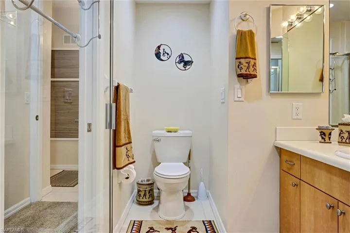 Full bathroom with vanity and tile flooring