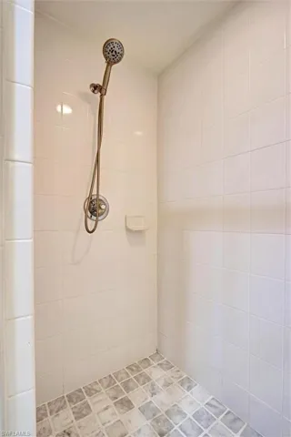 Updated bathroom with tiled walk-in shower stall