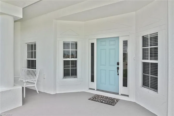 Doorway to property with a patio
