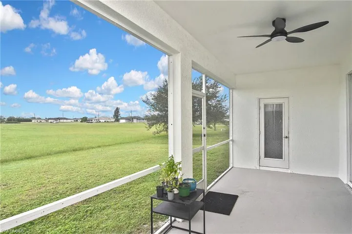 Unfurnished sunroom with a ceiling fan