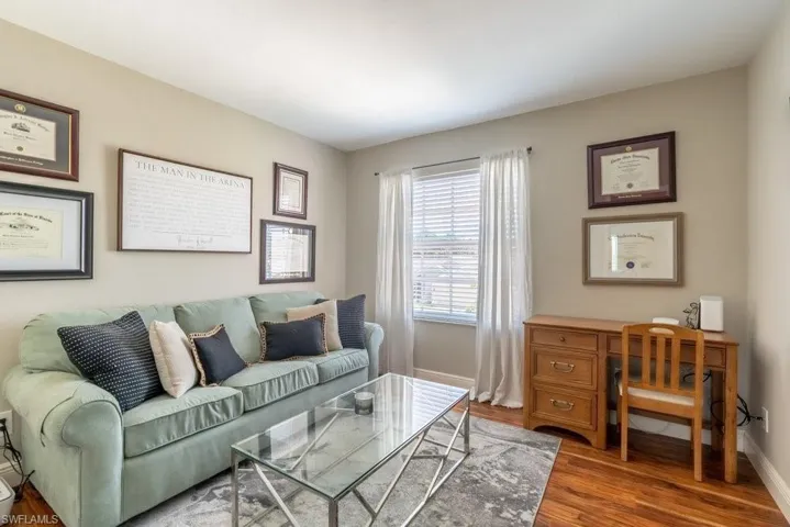 Living area featuring wood finished floors and baseboards