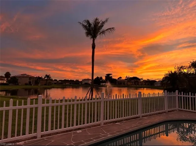 View of swimming pool with a water view