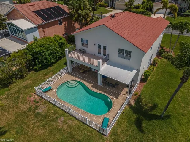 View of swimming pool featuring french doors, a fenced backyard, and a patio area