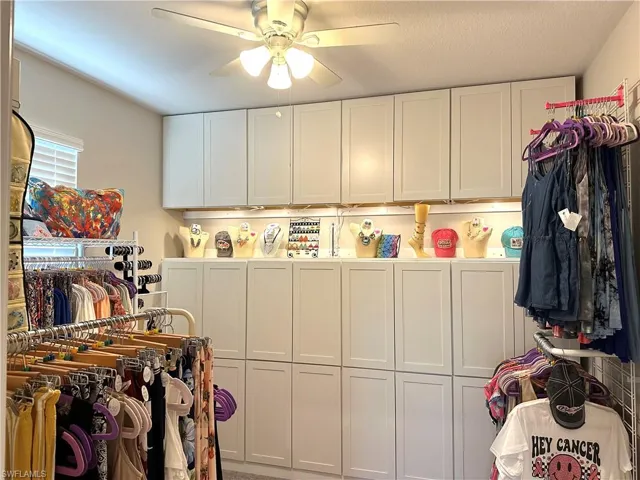 Clothes washing area with ceiling fan