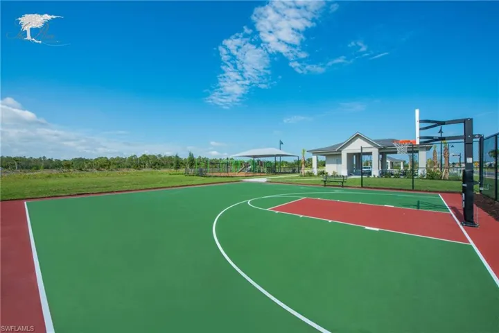 View of sport court featuring a yard