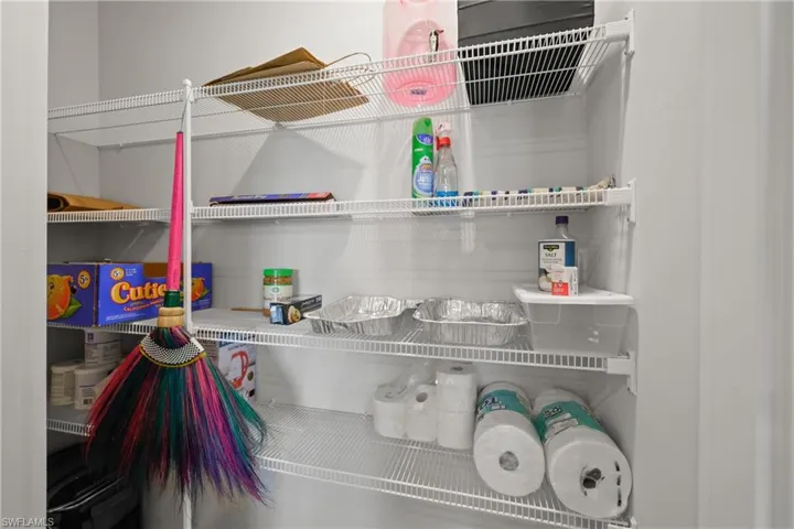 Interior storage closet featuring multiple wire shelving units