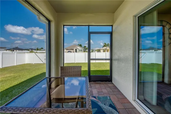 Screened lanai with decorative pavers