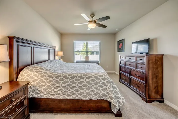 Primary suite featuring a large, luxurious bathroom and walk-in closet
