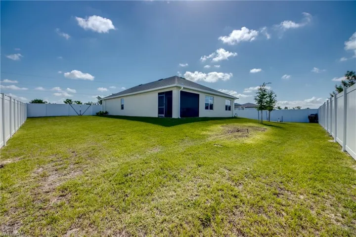 View of fenced-in backyard