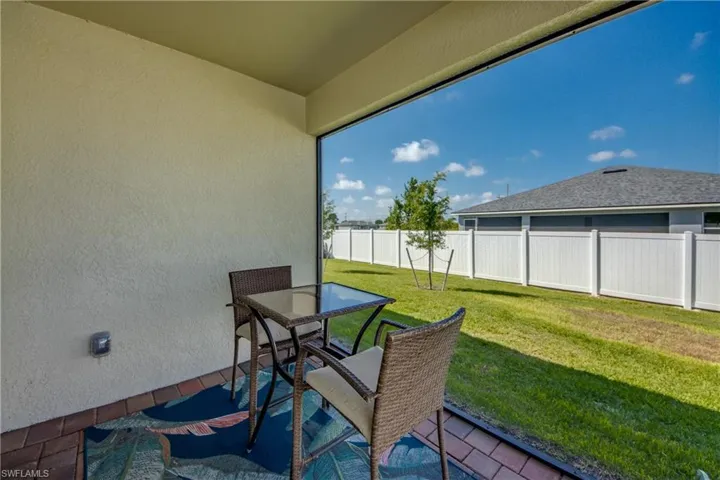Screened lanai with decorative pavers