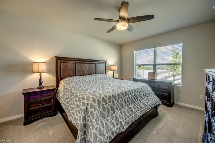 Primary suite featuring a large, luxurious bathroom and walk-in closet